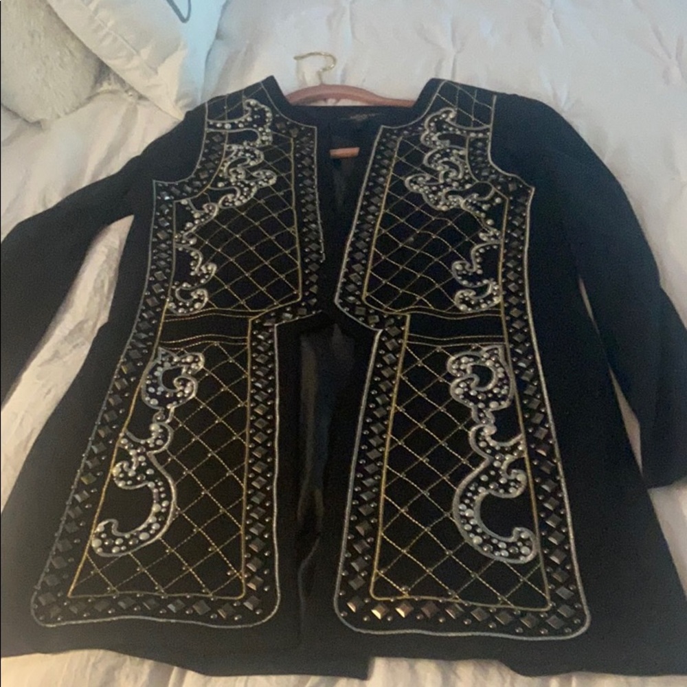 Beautiful black jacket with exquisite detailing.